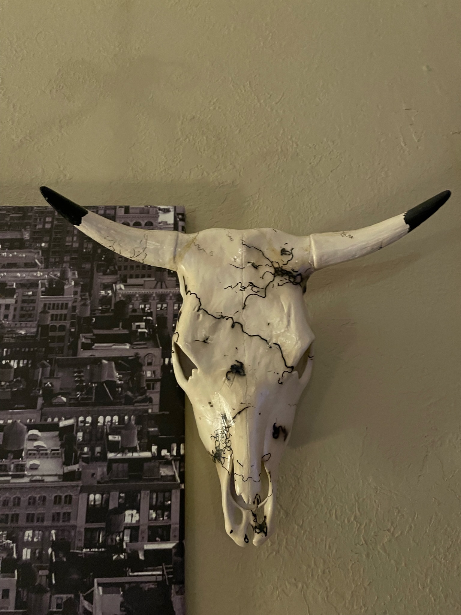 Bull skull wall decor with cityscape canvas art